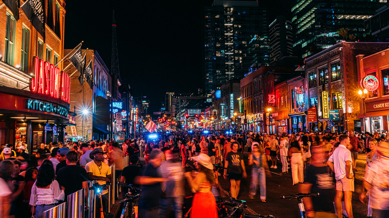 Tourists crowding the streets of downtown Nashville, Tennessee.