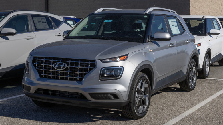 Hyundai Venue SEL compact SUV display at a dealership.