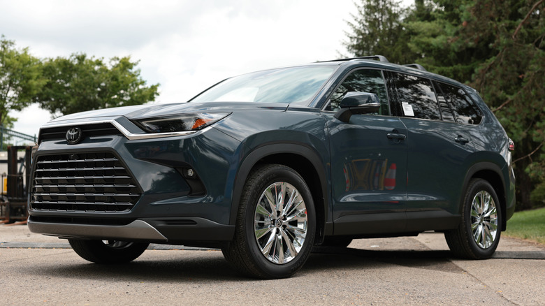 Toyota Grand Highlander parked in the road