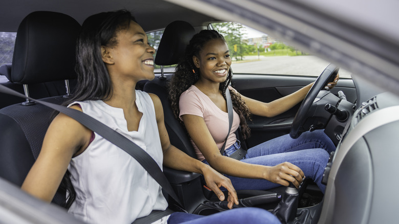 a teenage driver driving with her mother