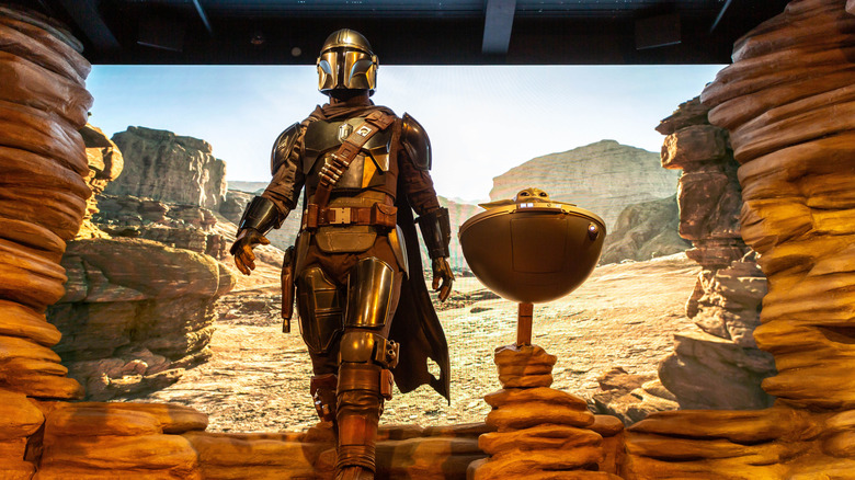 Realistic wax figures of The Mandalorian and Grogu