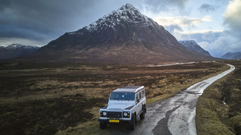 A Range Rover traversing a mountainous area.