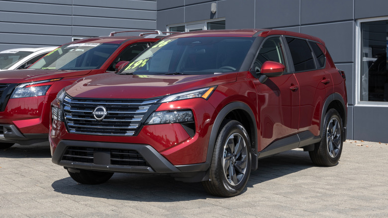 Nissan Rogue SV AWD SUV display at a dealership.