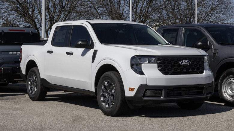 Ford Maverick XLT AWD truck display at a dealership.