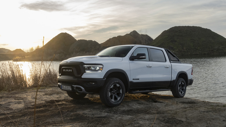 RAM 1500 Rebel stopped next to lake in a sunset.
