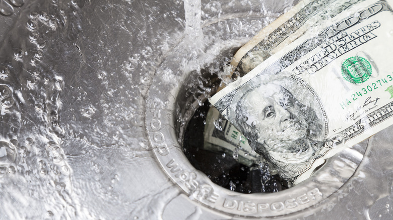 pouring money down drain