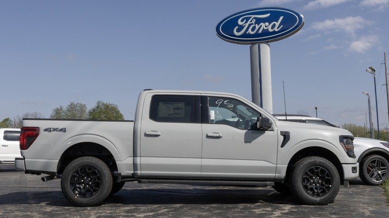 Ford F-150 4X4 Supercrew display at a dealership.