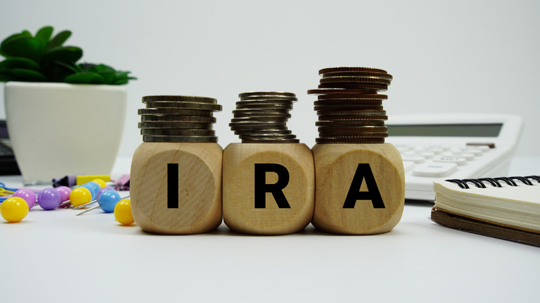 IRA in dice with coins stacked on top