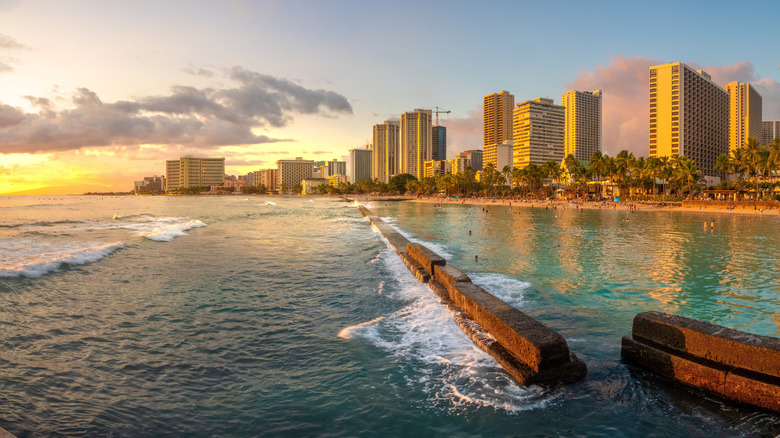Sunset beachside shot of Waikiki skyline