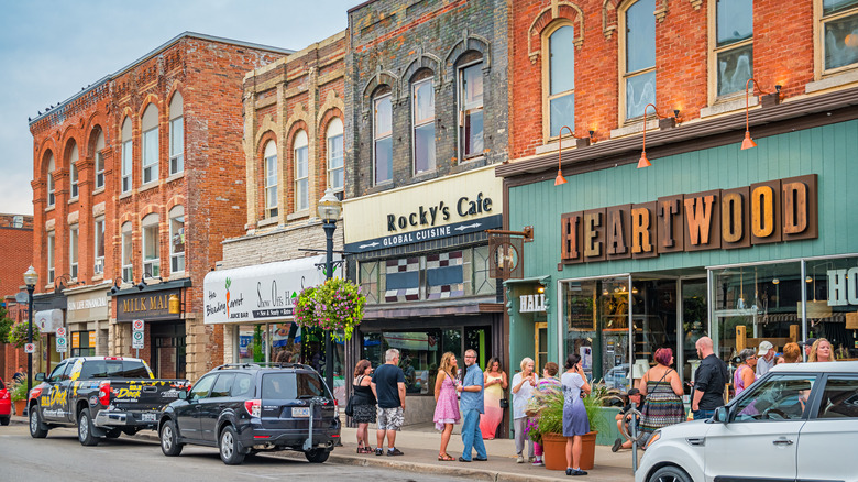 Shot of Owen Sound street as people stand outside Rocky's Cafe