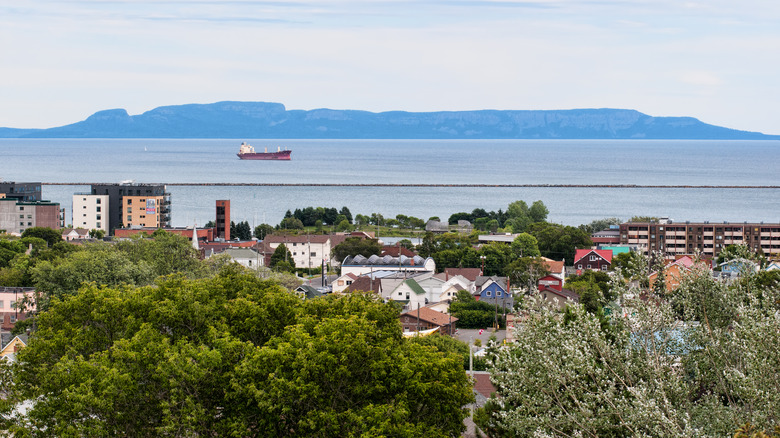 Thunder Bay village with shot of boat in the distance