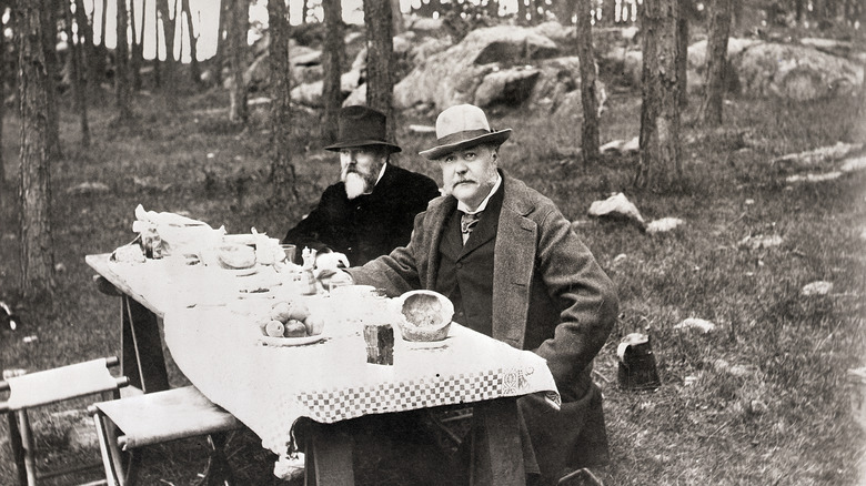 Chester A. Arthur, President of the U.S., during a camp lunch with his friend, Dawn. Photograph, 1897.