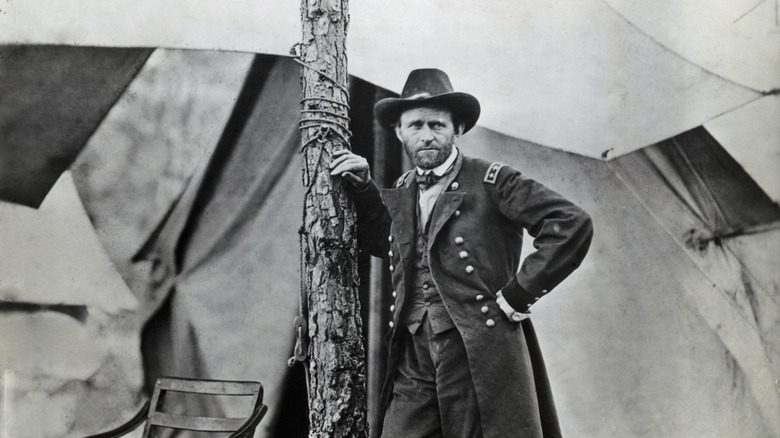General Grant stands in front of his campaign tent at his headquarters in City Point (now Hopewell), Virginia.