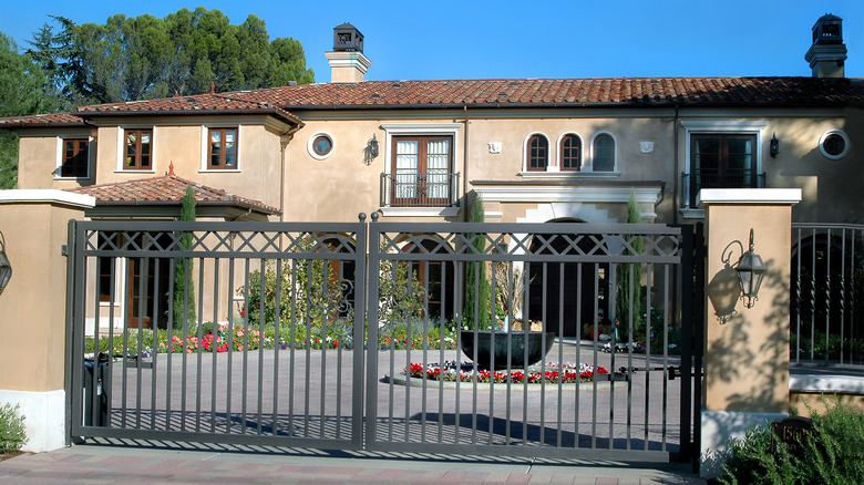 A massive home behind a gate in California.