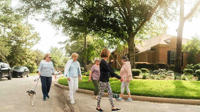 A group of senior women walking in a beautiful Texas suburb.