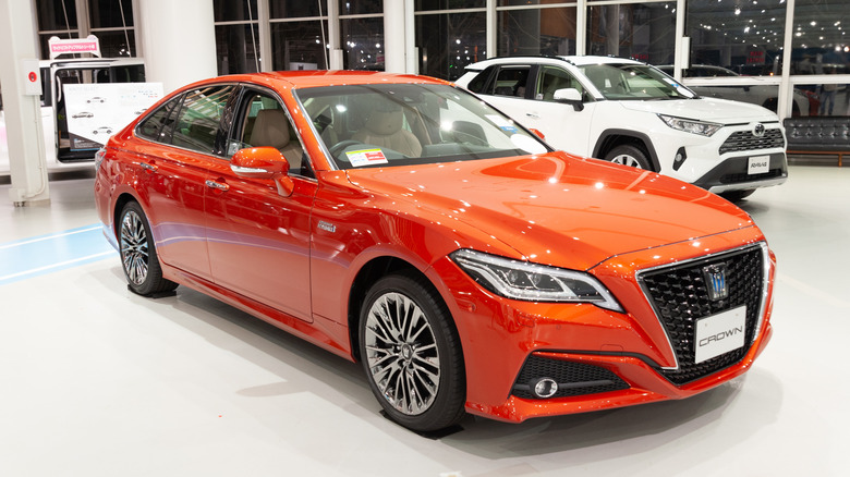 The Luxury Toyota Crown Hybrid 3.5 G-Executive orange color.