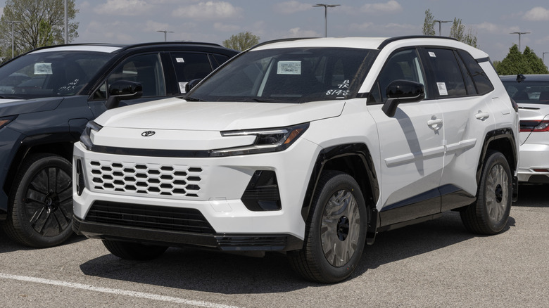 Toyota RAV4 SE Plug-In Hybrid AWD SUV at a dealership.