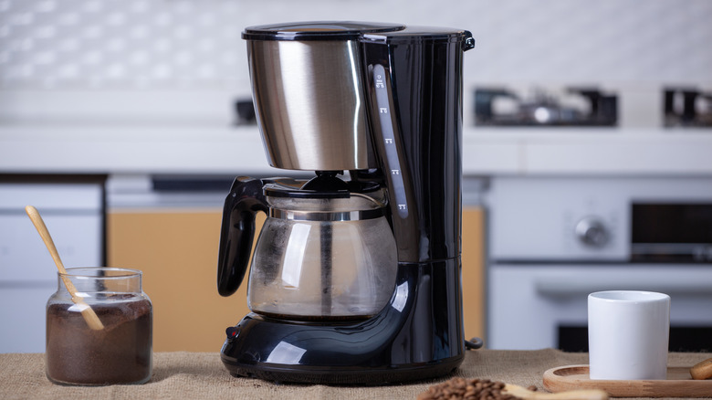 Black coffee machine, making a pot of hot coffee.
