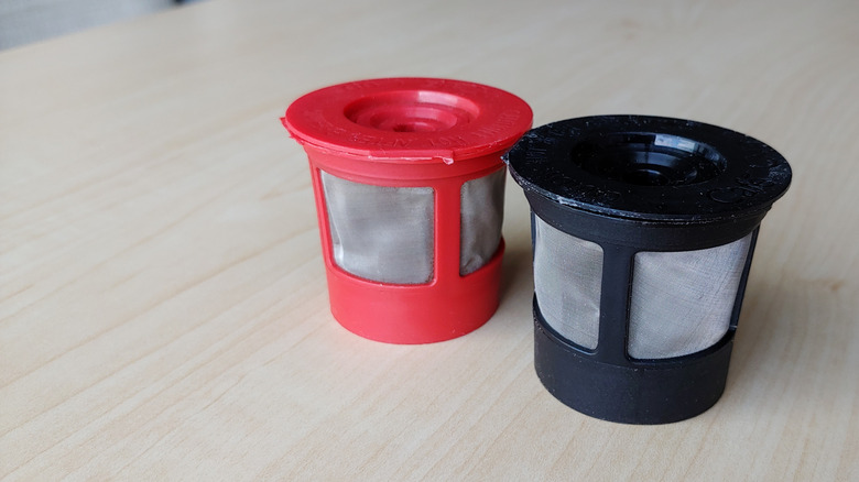 Two reusable coffee filters on a table.