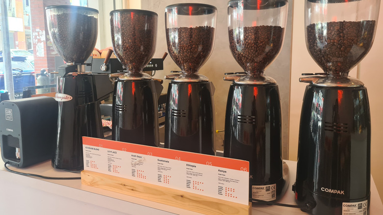 Kuala Lumpur, Malaysia 10th June 2023 : Compak brand coffee grinders for professional high-quality coffee grinders at cafe interior.