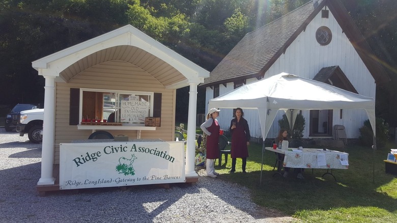 Members of the Ridge Civic Association holding an event