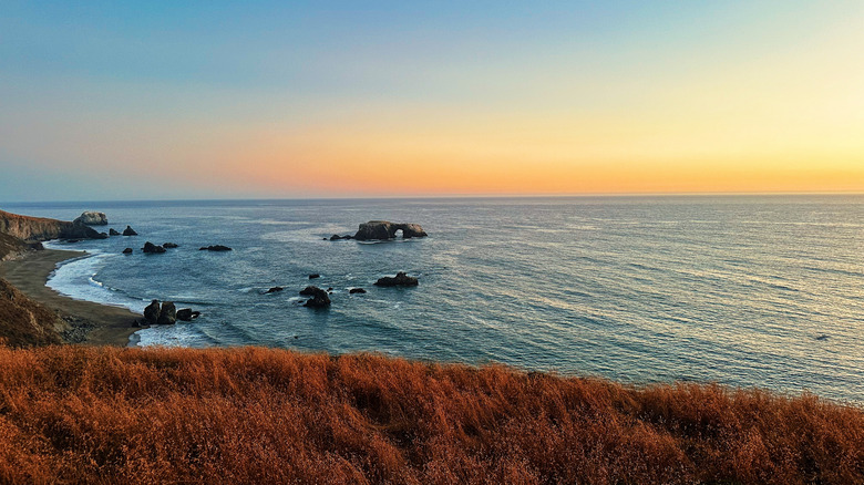 The sun setting over a Sonoma, California beach