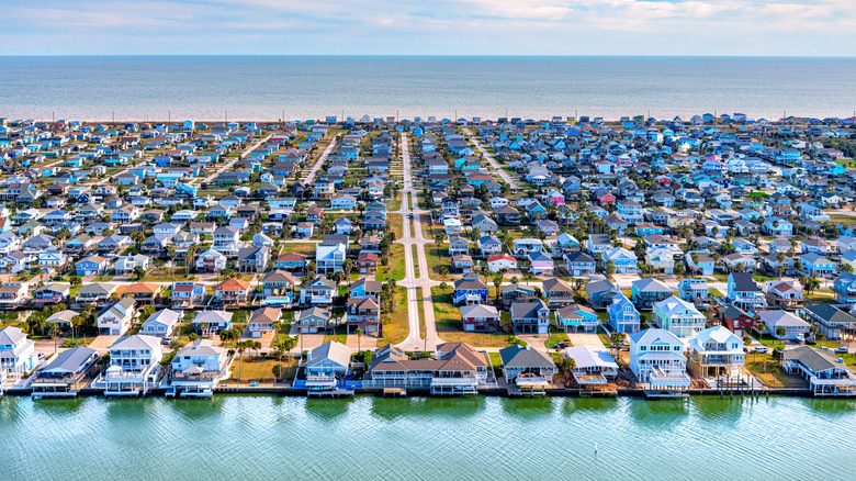Homes built on stilts in a beachfront subdivision located on Galveston Island, Texas