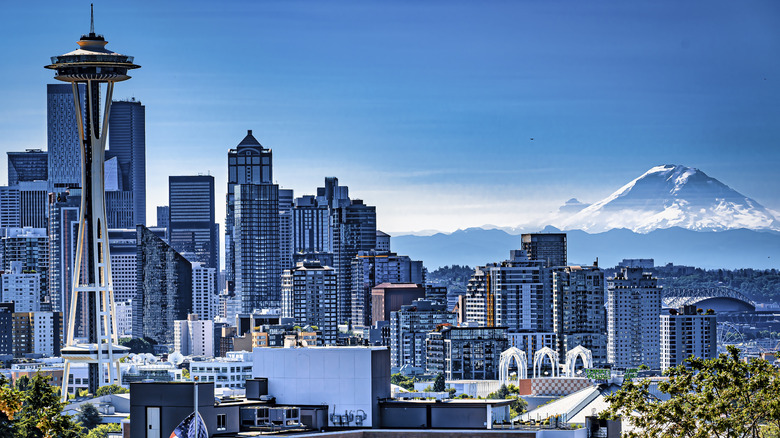 The Seattle skyline with Mount Rainier in the distance and the space needle in the foreground.
