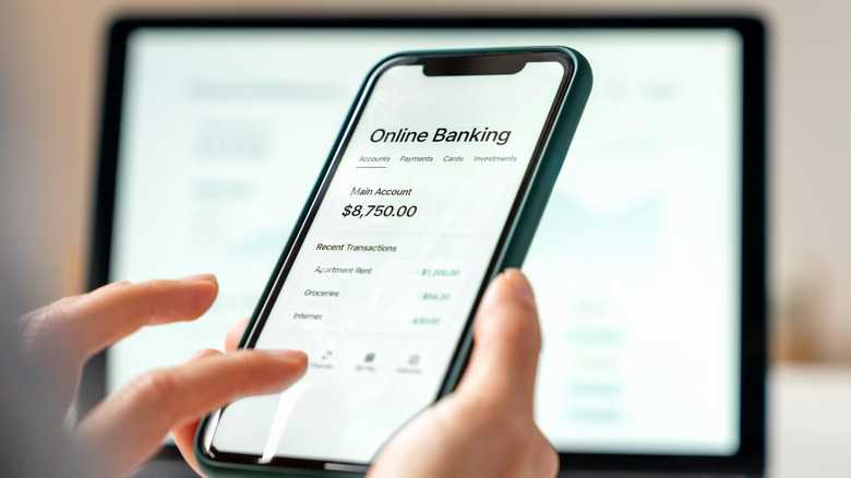 Women checking bank account online.