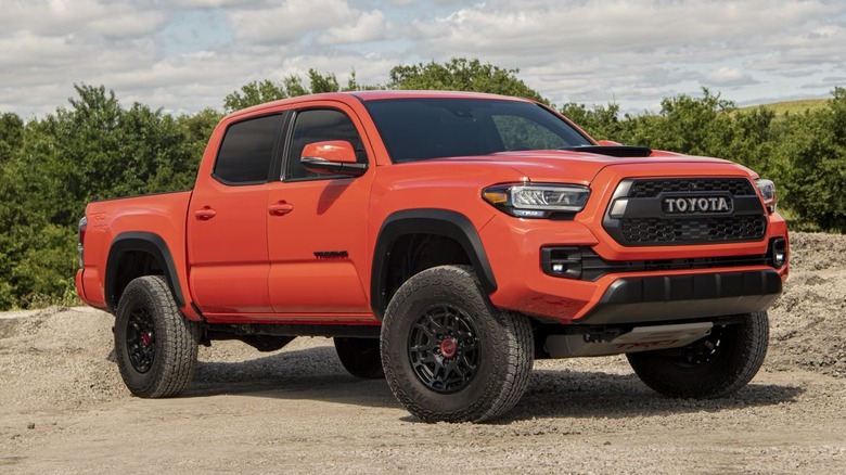 An orange 2023 Toyota Tacoma pickup truck