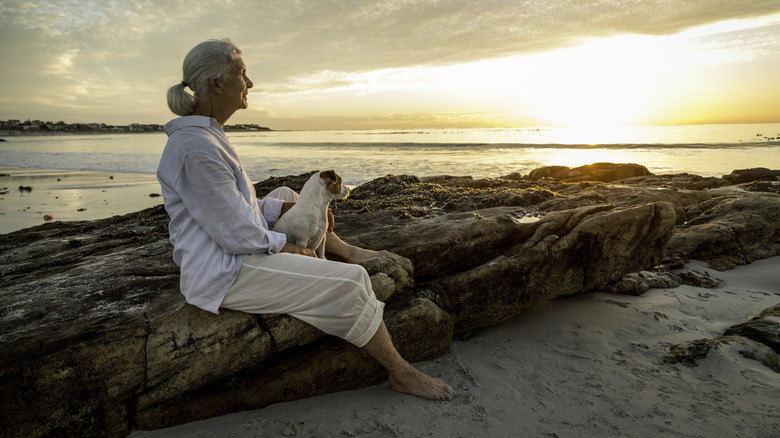 a retired woman on a beach