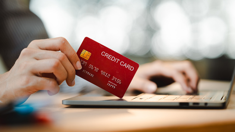 Hand holding credit card