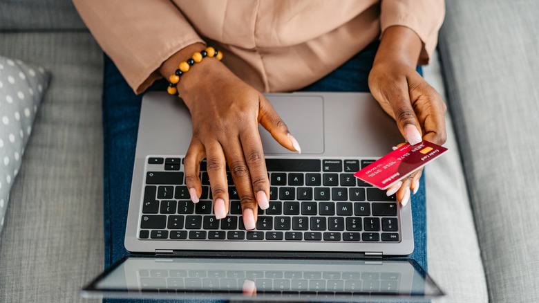 Black woman using Credit card