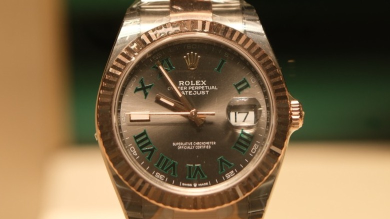 The golden watch face of a Rolex Oyster Perpetual Datejust