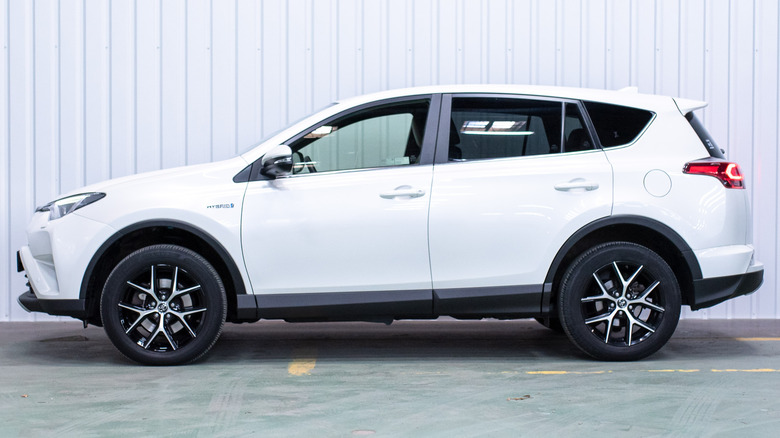 A side view of a white Toyota RAV4.