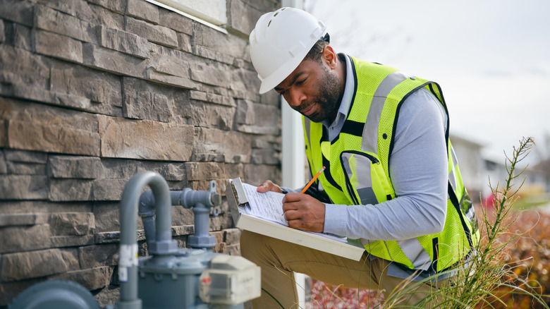 a home inspector evaluating a property