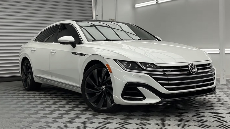 A white 2023 Volkswagen Arteon in a white and gray garage
