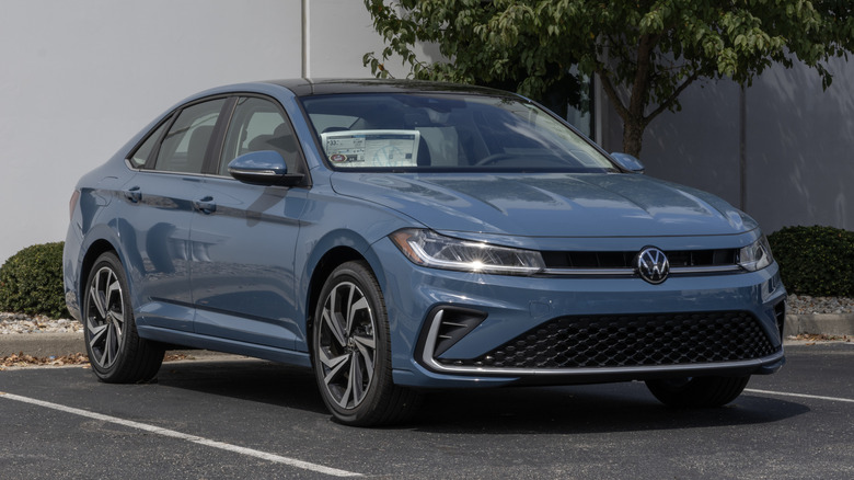 A blue 2026 Volkswagen Jetta 1.5T SEL Midsize Sedan at a dealership.