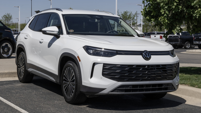 A white 2026 Volkswagen Tiguan FWD 2.0T S Family SUV on display on a sunny day.