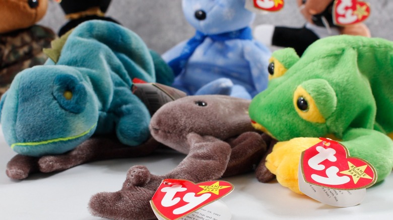 A collection of different kinds of Beanie Babies with their Ty tags still on.