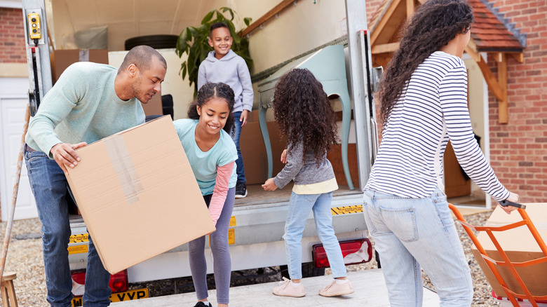 family loading a moving truck