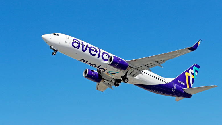 Avelo airlines plane flying through sky