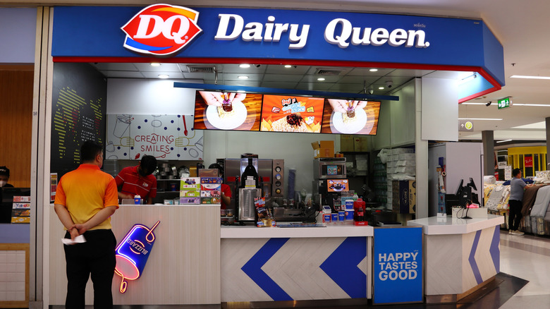 A customer awaits his order at a Dairy Queen counter