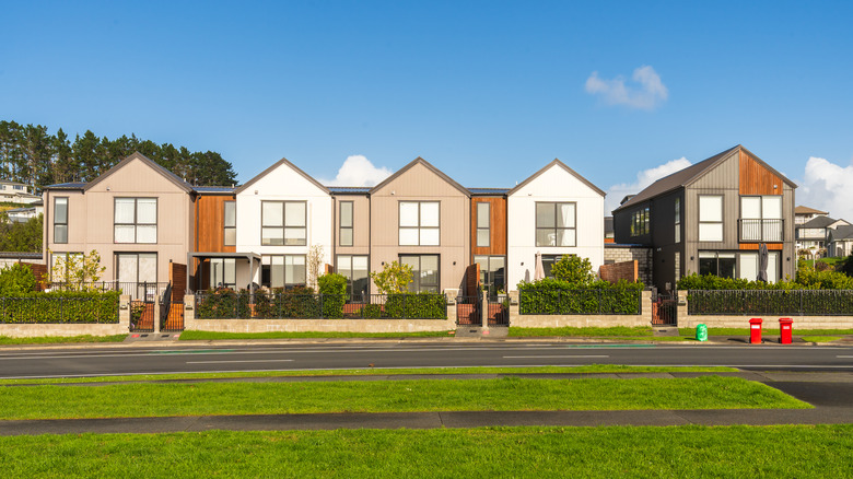 Row of modern attached houses, real estate neighborhood