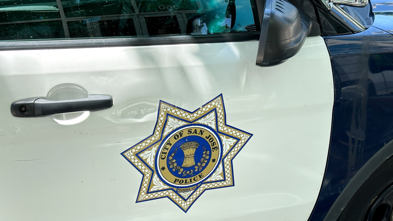 San Jose Police Department logo on a police vehicle
