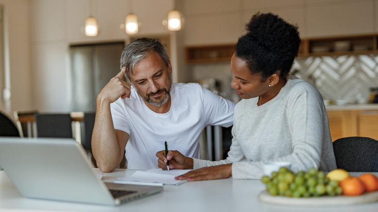 A couple looking over paperwork