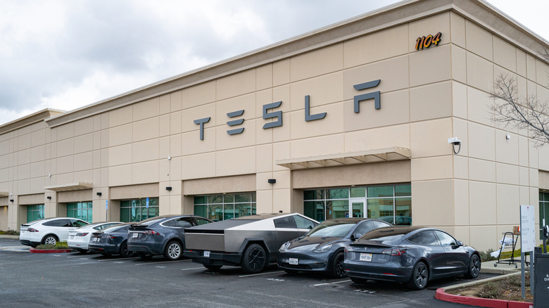 Exterior entrance of a Tesla Service and repair center with cybertruck.