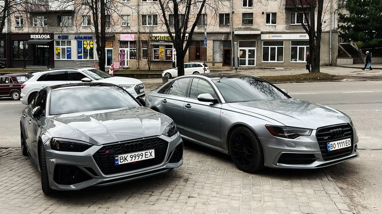 A pair of grey Audi A6 cars in Kyiv.