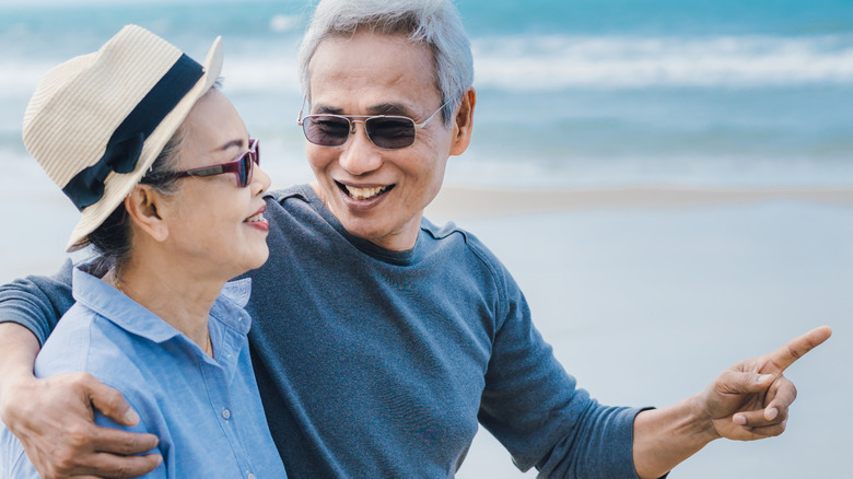 Mature couple walking on the beach