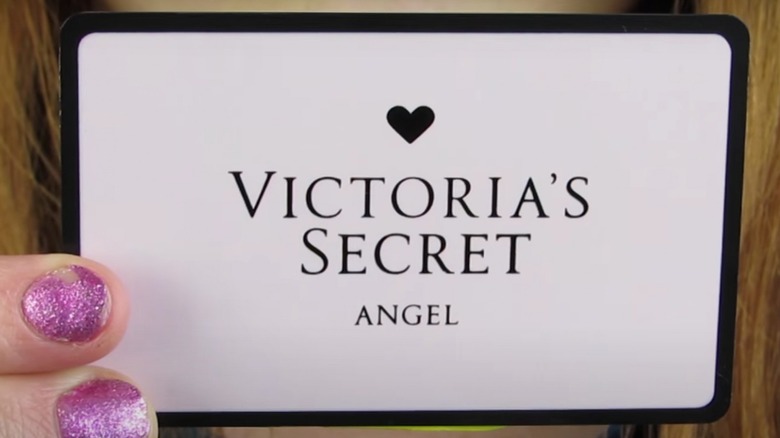 Person holding Victoria's Secret card